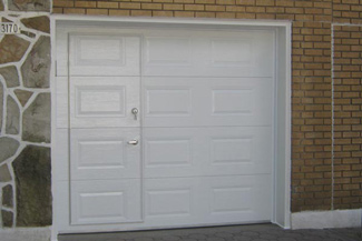 Add a door opener blocking mechanism to prevent the door opener from working if the pedestrian door is ajar